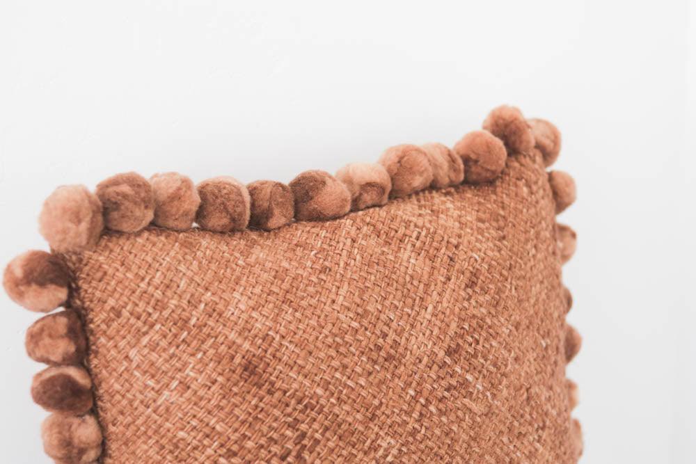 Salta Pom Pom 24" Pillow in Rust - Ebb and Thread